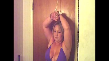 BJ is tied up and h. on the door